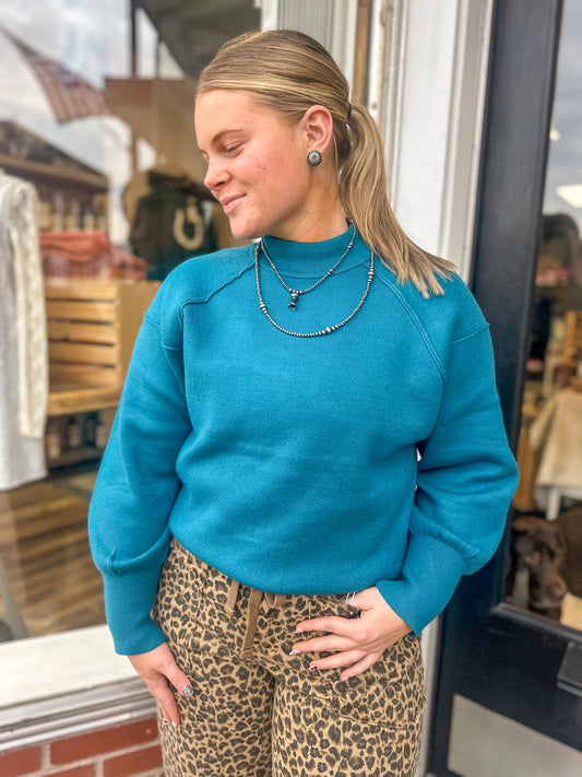 Mock Neck Exposed Seam Sweater